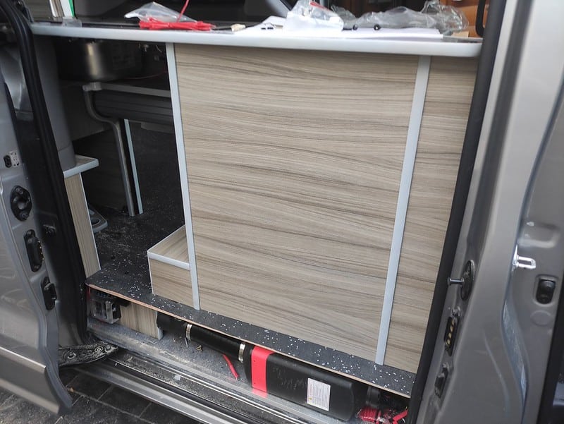 Diesel heater fitted under kitchen unit in a camper van conversion